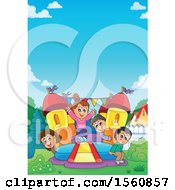 Group Of Children Playing On A Bouncy House Castle In A Yard