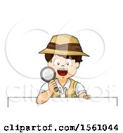 Boy Explorer Holding A Magnifying Glass Over A Sign