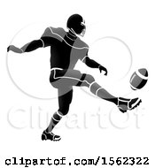 Clipart Of A Silhouetted Football Player Kicking Royalty Free Vector Illustration