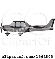 Clipart Of A Silhouetted Airplane With A Propeller Royalty Free Vector Illustration by Lal Perera