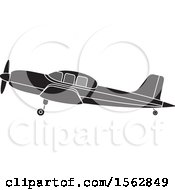 Poster, Art Print Of Silhouetted Airplane With A Propeller