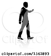 Poster, Art Print Of Silhouetted Business Man Walking With A Reflection Or Shadow