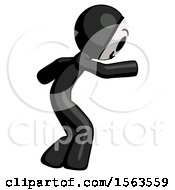 Black Little Anarchist Hacker Man Sneaking While Reaching For Something