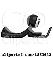 Black Little Anarchist Hacker Man Using Laptop Computer While Lying On Floor Side View