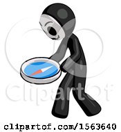 Black Little Anarchist Hacker Man Walking With Large Compass