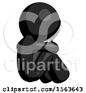 Black Little Anarchist Hacker Man Sitting With Head Down Back View Facing Right