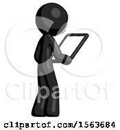 Black Little Anarchist Hacker Man Looking At Tablet Device Computer Facing Away