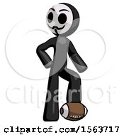 Black Little Anarchist Hacker Man Standing With Foot On Football