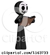 Black Little Anarchist Hacker Man Reading Book While Standing Up Facing Away