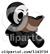 Black Little Anarchist Hacker Man Reading Book While Sitting Down