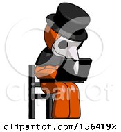 Orange Plague Doctor Man Using Laptop Computer While Sitting In Chair Angled Right