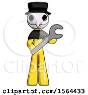 Poster, Art Print Of Yellow Plague Doctor Man Holding Large Wrench With Both Hands