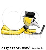Yellow Plague Doctor Man Using Laptop Computer While Lying On Floor Side View
