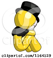 Yellow Plague Doctor Man Sitting With Head Down Back View Facing Right