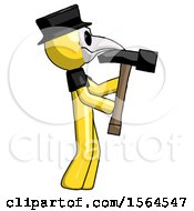 Poster, Art Print Of Yellow Plague Doctor Man Hammering Something On The Right