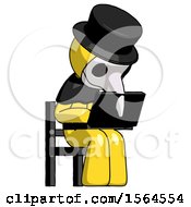 Poster, Art Print Of Yellow Plague Doctor Man Using Laptop Computer While Sitting In Chair Angled Right