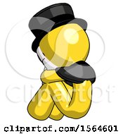 Yellow Plague Doctor Man Sitting With Head Down Back View Facing Left