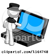 White Plague Doctor Man Using Large Laptop Computer