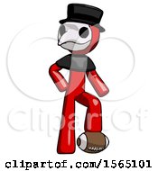 Red Plague Doctor Man Standing With Foot On Football