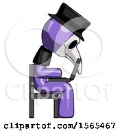 Purple Plague Doctor Man Using Laptop Computer While Sitting In Chair View From Side