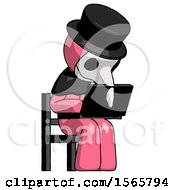 Poster, Art Print Of Pink Plague Doctor Man Using Laptop Computer While Sitting In Chair Angled Right