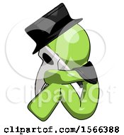 Poster, Art Print Of Green Plague Doctor Man Sitting With Head Down Facing Sideways Left