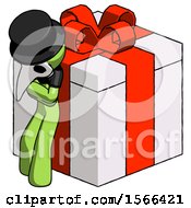 Poster, Art Print Of Green Plague Doctor Man Leaning On Gift With Red Bow Angle View