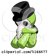 Poster, Art Print Of Green Plague Doctor Man Sitting With Head Down Facing Angle Left