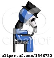 Blue Plague Doctor Man Using Laptop Computer While Sitting In Chair View From Side