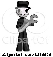 Black Plague Doctor Man Holding Large Wrench With Both Hands