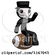 Poster, Art Print Of Black Plague Doctor Man Sitting On Giant Football