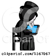 Black Plague Doctor Man Using Laptop Computer While Sitting In Chair View From Back