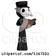 Black Plague Doctor Man Reading Book While Standing Up Facing Away