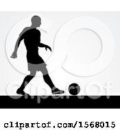 Poster, Art Print Of Black Silhouetted Male Soccer Player Over Gray