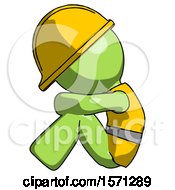 Green Construction Worker Contractor Man Sitting With Head Down Facing Sideways Left