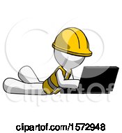 Poster, Art Print Of White Construction Worker Contractor Man Using Laptop Computer While Lying On Floor Side Angled View