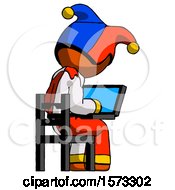 Poster, Art Print Of Orange Jester Joker Man Using Laptop Computer While Sitting In Chair View From Back