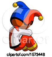 Poster, Art Print Of Orange Jester Joker Man Sitting With Head Down Back View Facing Right