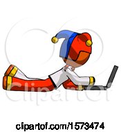 Poster, Art Print Of Orange Jester Joker Man Using Laptop Computer While Lying On Floor Side View