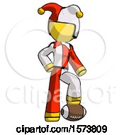 Poster, Art Print Of Yellow Jester Joker Man Standing With Foot On Football