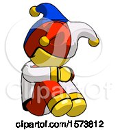 Poster, Art Print Of Yellow Jester Joker Man Sitting With Head Down Facing Angle Right