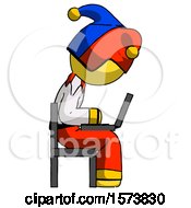 Poster, Art Print Of Yellow Jester Joker Man Using Laptop Computer While Sitting In Chair View From Side