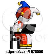 Poster, Art Print Of White Jester Joker Man Using Laptop Computer While Sitting In Chair Angled Right