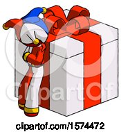 Red Jester Joker Man Leaning On Gift With Red Bow Angle View