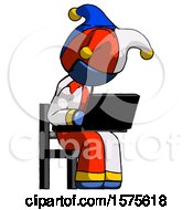 Poster, Art Print Of Blue Jester Joker Man Using Laptop Computer While Sitting In Chair Angled Right