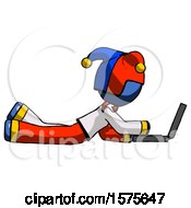 Poster, Art Print Of Blue Jester Joker Man Using Laptop Computer While Lying On Floor Side View