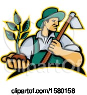 Male Farmer Holding A Hoe And Seedling Plant