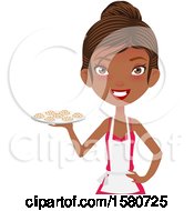 Clipart Of A Happy Black Female Chef Or Baker Wearing An Apron And Serving Chocolate Chip Cookies Royalty Free Vector Illustration by Melisende Vector