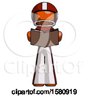 Orange Football Player Man Reading Book While Standing Up Facing Viewer