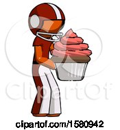 Orange Football Player Man Holding Large Cupcake Ready To Eat Or Serve